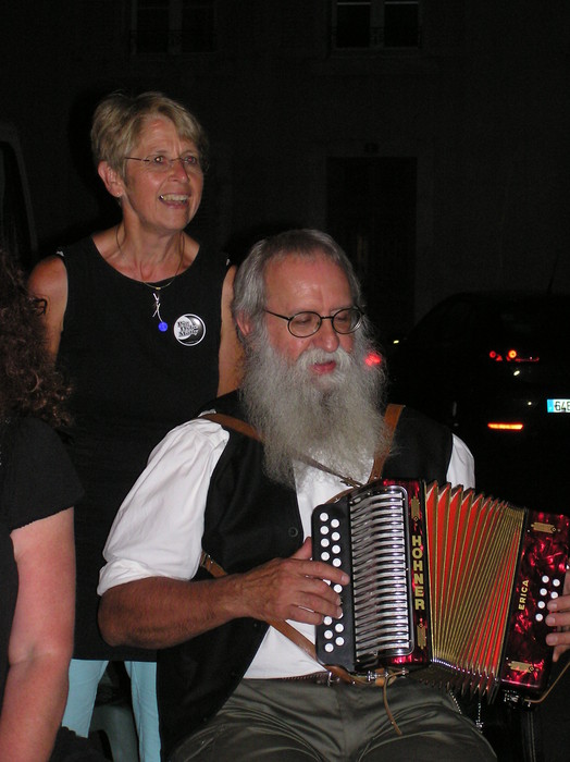<p>French box player, also playing fiddle in the other photos. He's Jean Blanchard, François's brother. Anne-Marie stands behind.</p>