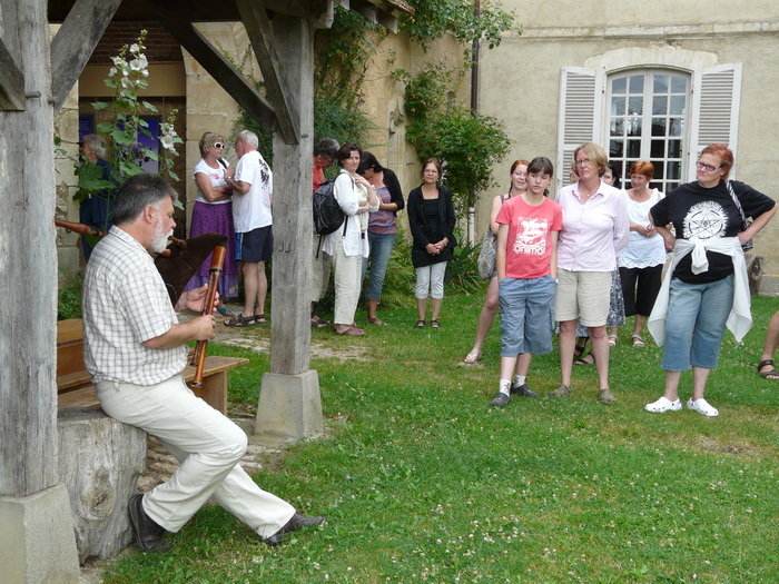 <p>Chateau Le Plaix is the property of an other folk dance group, friends of Notre Berry. Mic (with the bagpipe) was also our tour guide of the Chateau, which is a museum of C.19 and early C.20 "paysan" life.</p>