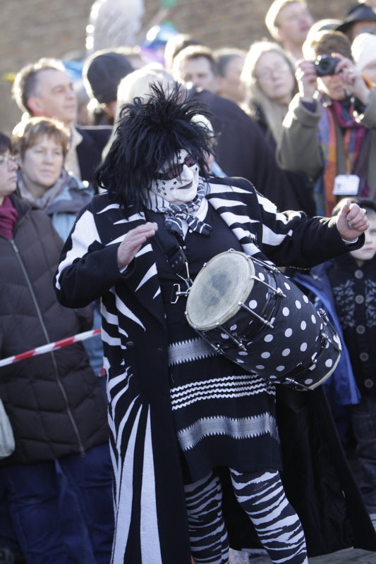 <p>Whittlesea Straw Bear 2012 in the Market Place -
Chris and drum<br>
<i>Photo by David Muscroft</i></p>
